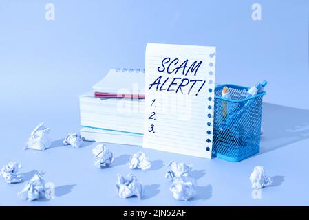 Text sign showing Scam Alert. Concept meaning warning someone about scheme or fraud notice any unusual Important Idea Shown On Note On Desk With Cup Stock Photo