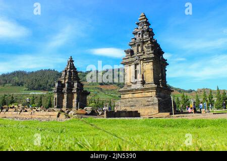 Wonosobo, Indonesia - June 2020 : Local tourists visit Arjuna temple complex at Dieng Plateau after the covid 19 emergency response period Stock Photo