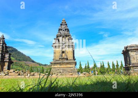 Wonosobo, Indonesia - June 2020 : Local tourists visit Arjuna temple complex at Dieng Plateau after the covid 19 emergency response period Stock Photo