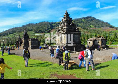 Wonosobo, Indonesia - June 2020 : Local tourists visit Arjuna temple complex at Dieng Plateau after the covid 19 emergency response period Stock Photo