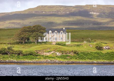 Loch Dunvegan,Isle of Skye, isolated detached home house on the shores of the Loch,Scotland,UK,Summer 2022 Stock Photo