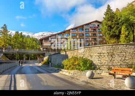 Zermatt, Switzerland - October 7, 2019: Town street view in famous Swiss Alps ski resort, Matterhorn snow mount Stock Photo