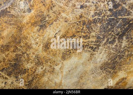 Natural stone background with golden veins. Granite slab stone, rustic matt texture Stock Photo