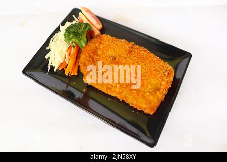 chicken katsu don is japanese food served with soy sauce on table Stock Photo