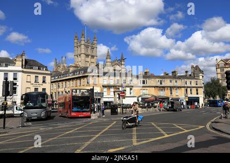 Rider on a cargo electric bicycle cycling on the road in Bath city centre Stock Photo