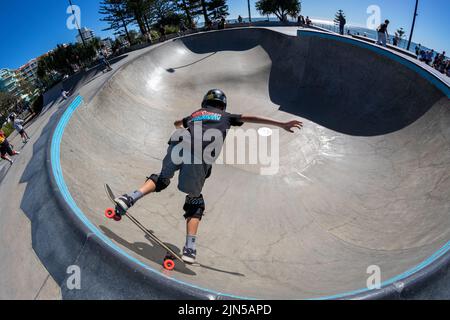 The young skater in Alexandra headland skatepark. Maroochydore, Australia. Stock Photo