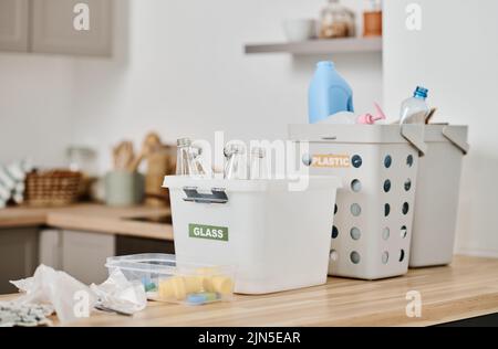 Horizontal image of containers with plastic and papers for separation garbage at home Stock Photo