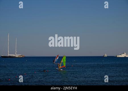 Windsurfing in the beach resort of Paralia Varkiza near Athens in Greece Stock Photo