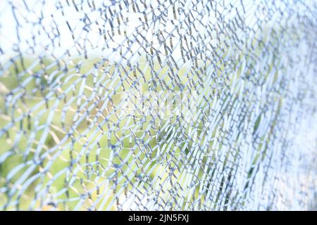A large pane of safety glass in a patio door that has spontaneously cracked. Stock Photo