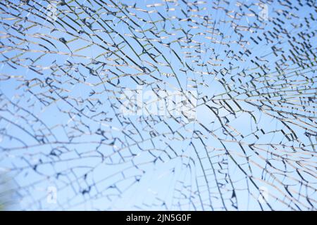 A large pane of safety glass in a patio door that has spontaneously cracked. Stock Photo