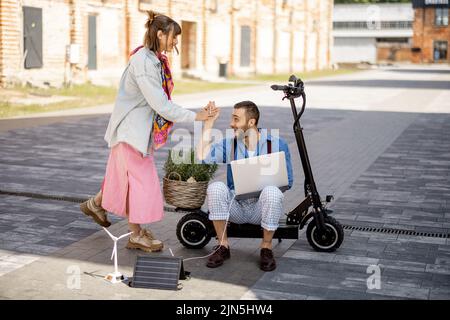 Stylish colleagues meet together outdoors Stock Photo