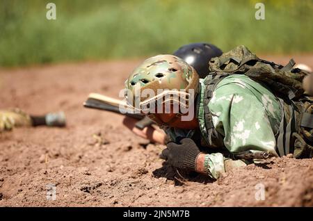 Special forces soldier with weapon take part in military maneuver. War, army, technology and people concept Stock Photo