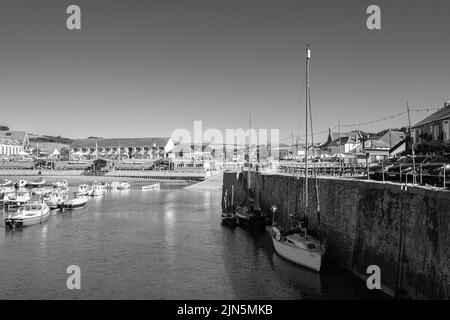 A beautiful ketch leaves Porthleven harbour Stock Photo