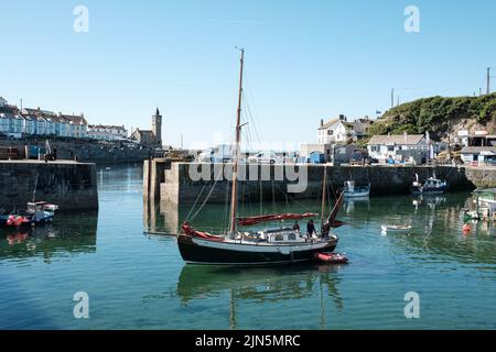 A beautiful ketch leaves Porthleven harbour Stock Photo