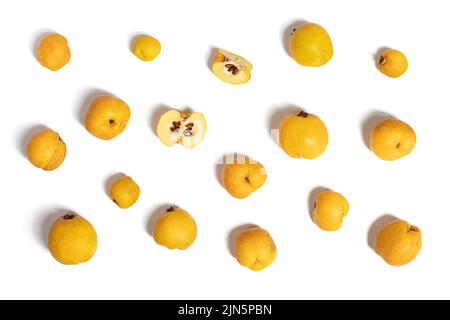 Quince pattern isolated on white background. Yellow ripe quince fruits. Top view, flat lay. Stock Photo