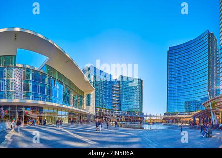 MILAN, ITALY - APRIL 9, 2022: Modern neighborhhod on Piazza Gae Aulenti, on April 9 in Milan, Italy Stock Photo