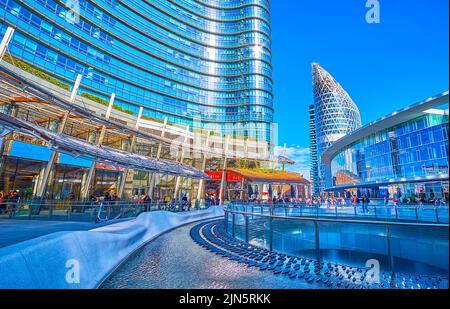 MILAN, ITALY - APRIL 9, 2022: Piazza Gae Aulenti square is the heart of modern district, on April 9 in Milan, Italy Stock Photo