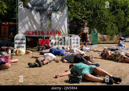 Bristol, UK. 9th Aug, 2022. Peace groups are remembering the lives of those killed when the A-Bomb was dropped on Nagasaki in World War Two. A Die-in was carried out at 11.02am, the same time that Nagasaki was bombed on 9th Aug 1945. Credit: JMF News/Alamy Live News Stock Photo