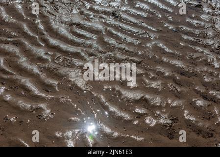 Wave patterns in the sand Stock Photo
