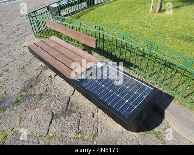 Viva smart bench with solar panel and wifi, qr code, in Sorrento, Campania, Italy Stock Photo