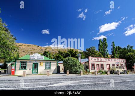 Two wooden buildings of the Gold rush pioneering days in Cardrona is the Cardrona Hotel one of New Zealand's oldest historic hotels. The other is the Stock Photo