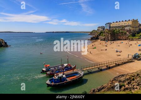 Castle Beach and some of the boats waiting to take visitors on a popular trip to Caldey Island from Tenby, Pembrokeshire, Wales, UK Stock Photo