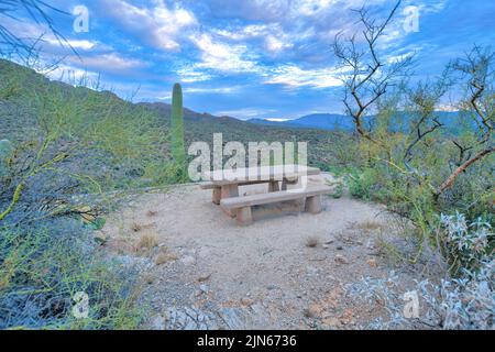 Concrete dining table with an overlooking view of mountains at Sabino Canyon in Tucson, AZ Stock Photo