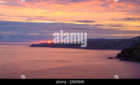 Sunset over the Cornish coast at Pendeen Stock Photo