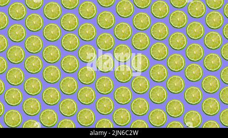 Colorful pattern of ripe lime slices on a purple and lilac background. High quality photo Stock Photo