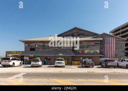 Perdido Key, FL - March 27, 2022: Exterior view of the famous Flora-Bama beach and oyster bar.  The Flora-Bama is a well-known landmark, straddling th Stock Photo