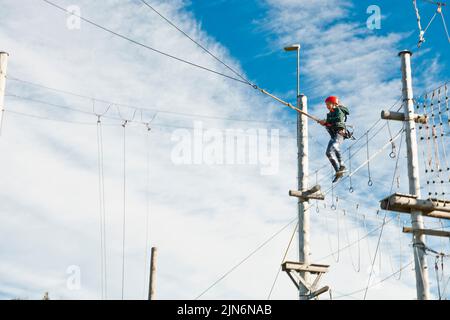 girl using a giant swing at high rope access course in Iceland Stock ...