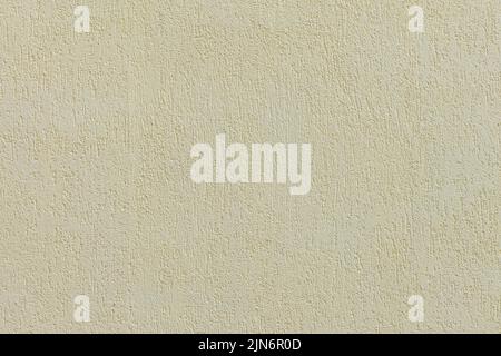 Beige plastered wall texture. Seamless surface and abstract solid background. Pale painted wall built structure. Stock Photo