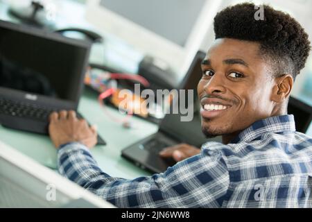 computer repairman specialist repairing computer desktop Stock Photo