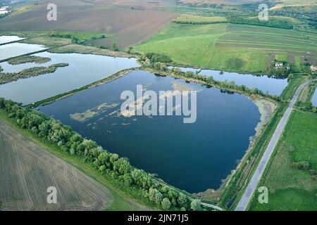 Aerial view of fish hetching pond with blue water in aquacultural area Stock Photo