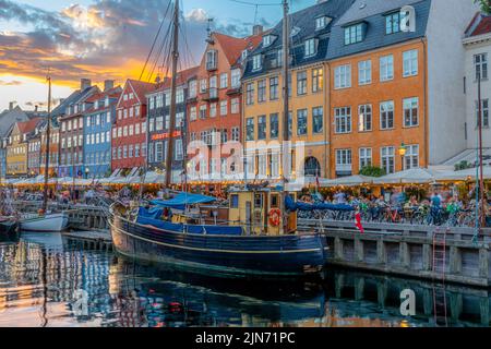 A beautiful shot of a famous tourist spot Nyhavn in Copenhagen with colorful buildings and boats Stock Photo
