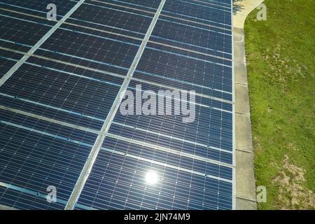 Solar panels installed over parking lot for parked cars for effective generation of clean energy Stock Photo