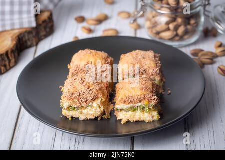 Traditional turkish new dessert cold milky baklava with pistachio (Turkish name; soguk baklava) Stock Photo