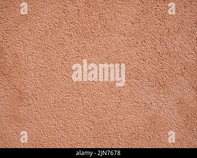 Peach coloured rough wall texture Stock Photo