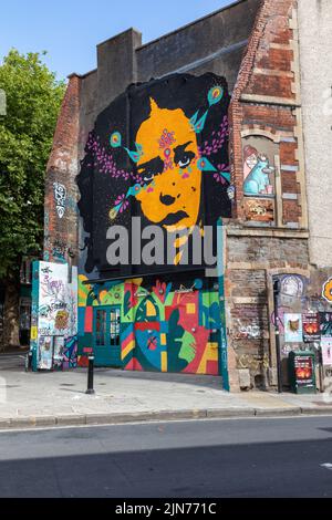 Contemporary Street Art - urban graffiti on a wall in Stokes Croft, Bristol, England, UK Stock Photo