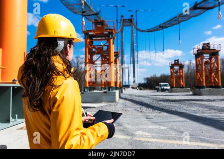 Engineer at work with digital tablet on a sunny spring day Stock Photo