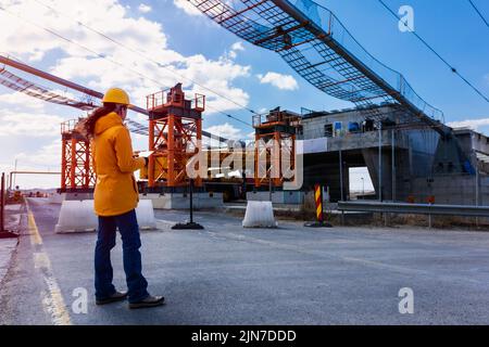 Women engineer supervising the construction site Stock Photo