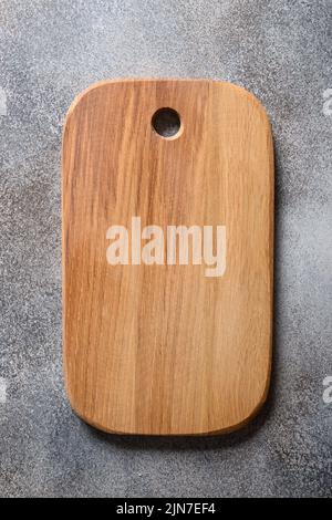 Empty white marble board on light gray stone table. Cooking concept with copy space. Stock Photo