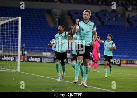 Cardiff, UK. 09th Aug, 2022. Joe Piggott of Portsmouth (10) celebrates with teammates after he scores their 1st goal. EFL Carabao cup round 1 match, Cardiff city v Portsmouth at the Cardiff City Stadium in Cardiff, Wales on Tuesday 9th August 2022. this image may only be used for Editorial purposes. Editorial use only, license required for commercial use. No use in betting, games or a single club/league/player publications. pic by Andrew Orchard/Andrew Orchard sports photography/Alamy Live news Credit: Andrew Orchard sports photography/Alamy Live News Stock Photo