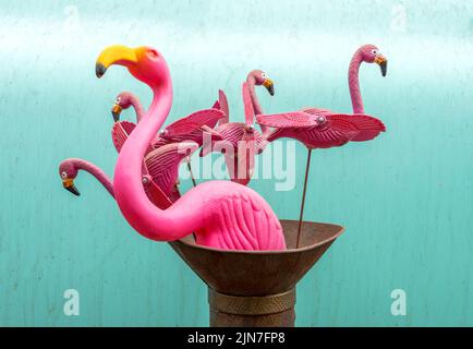 Flamingo Yard-Spinners Against Turquoise Blue Background Stock Photo