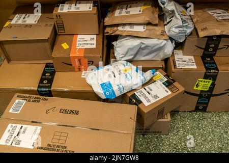 The largesse of online shopping is strewn across the mailbox area in an apartment building in New York on Monday, July 25, 2022. (© Richard B. Levine)