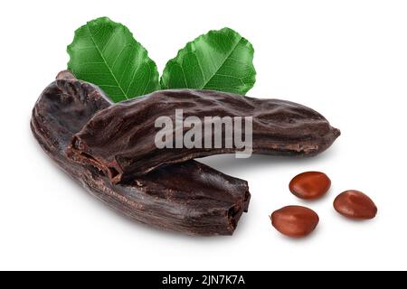 Ripe carob pods and bean isolated on white background with full depth of field Stock Photo