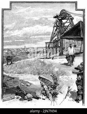 Engraving of a poppet head of a gold mine overlooking a mining town Stock Photo