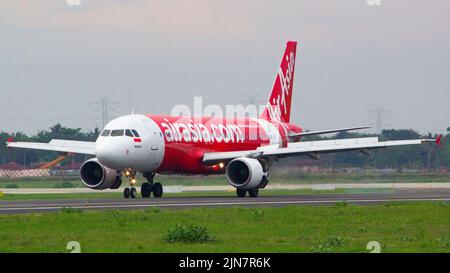 Indonesia AirAsia (QZ/AWQ) Airbus A320-216 PK-AZP ex Thai AirAsia HS-ABB (MSN: 3299) landing at runway 29 Yogyakarta International Airport (YIA/WAHI) Stock Photo