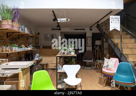 Barcelona, Spain - April 19 2022: Interior of a store with household decorative goods from chairs to plants Stock Photo