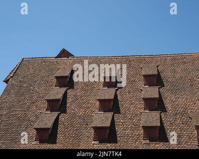 ancient dormer windows in a high roof Stock Photo - Alamy